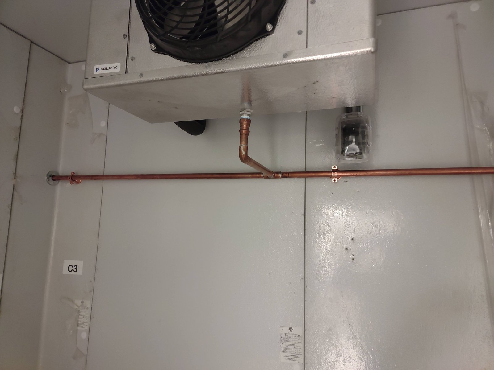 Copper piping within a mechanical space.