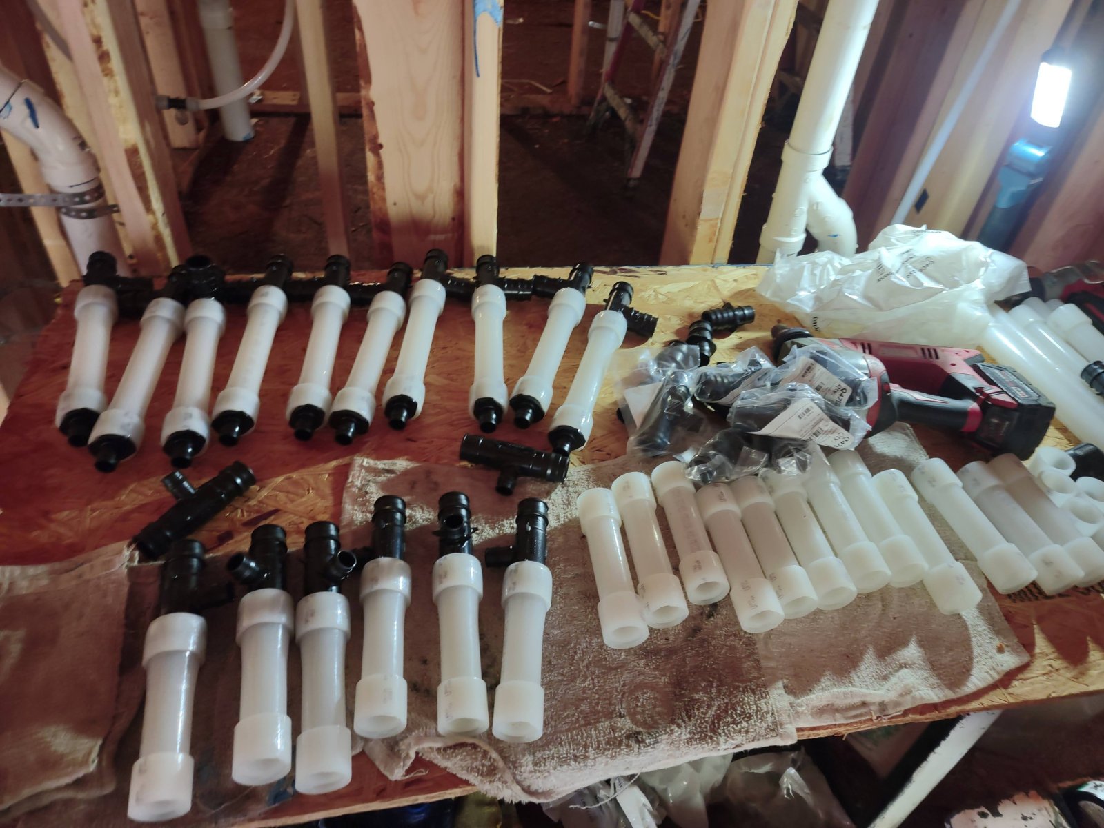 Plumbing assemblies prepared for installation.